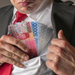 Ilustrasi uang rupiah terkait dugaan permintaan THR dalam kasus K3 Kemnaker