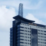 Gedung Polda Metro Jaya, potret Ade Armando, Abu Janda, dan Jusuf Kalla terkait laporan dugaan provokasi